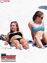12 pictures - Bikini girls erotically lie on beach