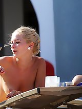 12 pictures - Bikini chicks stretch on the beach