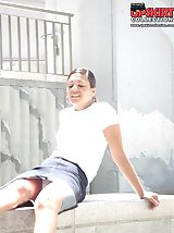 24 pictures - Young brunette caught sitting. Candid upskirt