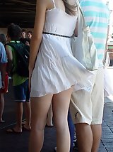 12 pictures - Pics wind blowing up skirts. Slim blondie caught