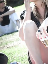 12 pictures - Blondie in black. Hidden camera up skirt